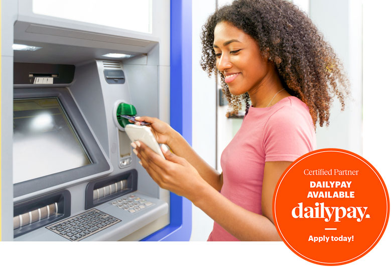 A woman in Bossier City uses dailypay service to withdraw money from an ATM