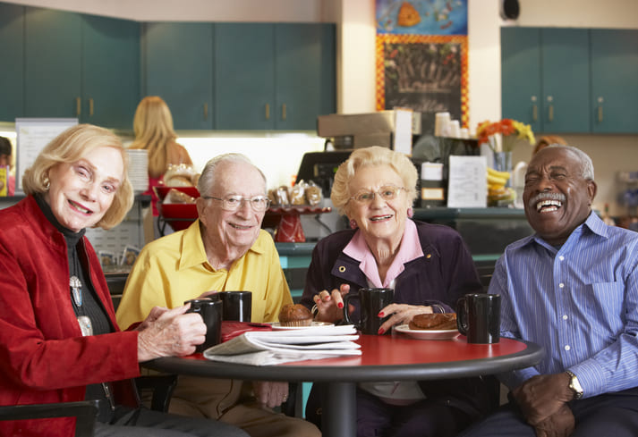 A group of aged people enjoying coffee at a nursing & rehabilitation center in Bossier City, LA