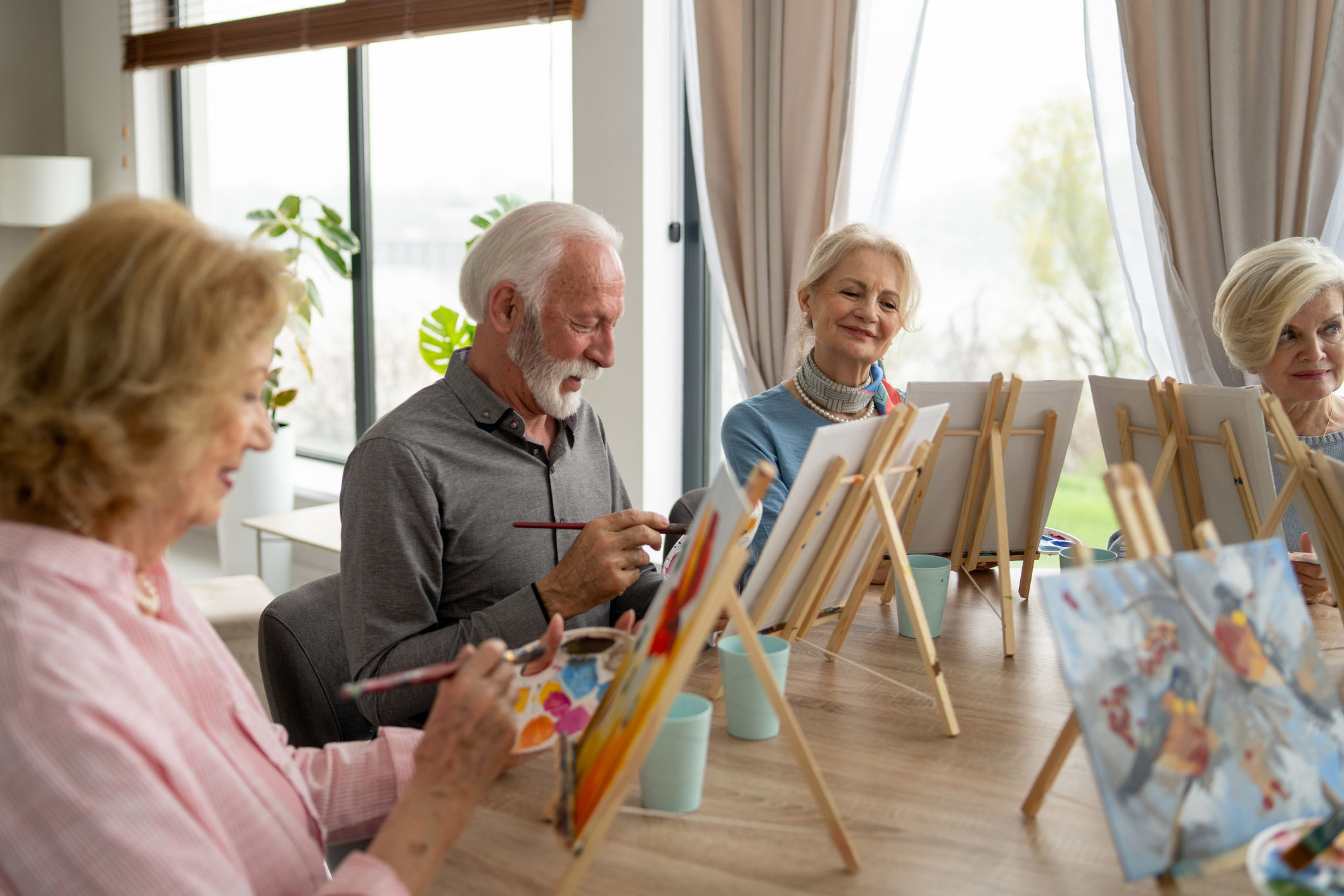 Seniors engage wholeheartedly in a casual painting class