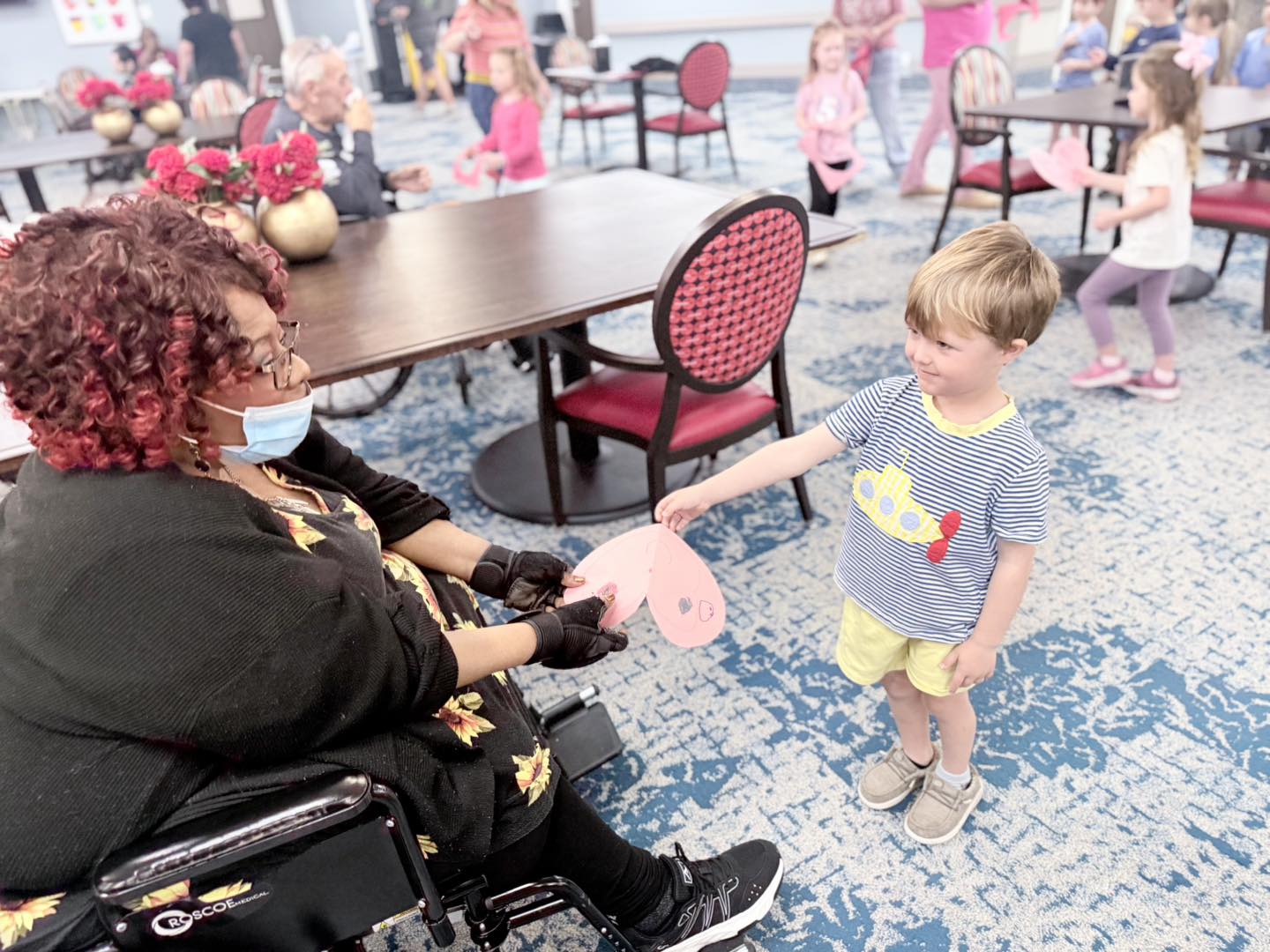 event for nursing home residents where kids bring around gifts at Pilgrim Manor Skilled Nursing & Rehab in GreenAcres Place in Bossier City, LA
