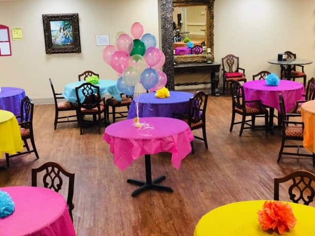 Colorful decorated tables and balloons at Pilgrim Manor