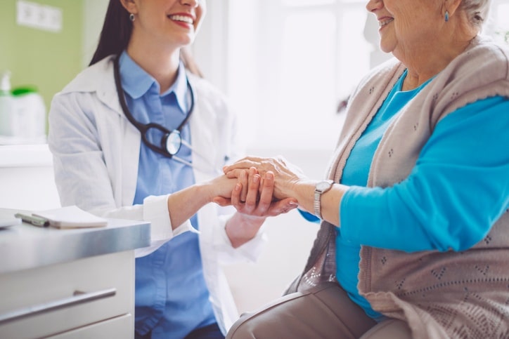 Doctor consulting a senior patient in long-term care