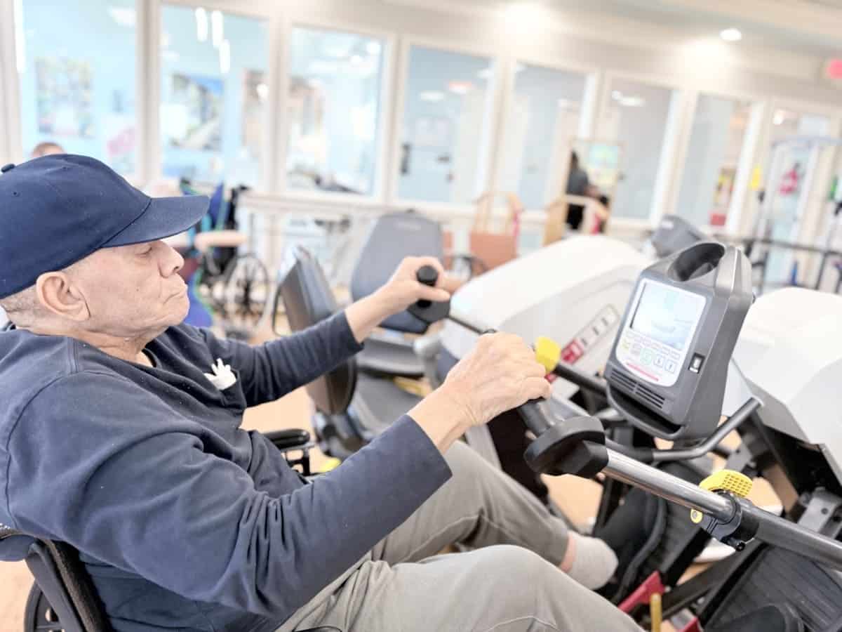 Resident exercising on a therapy bike