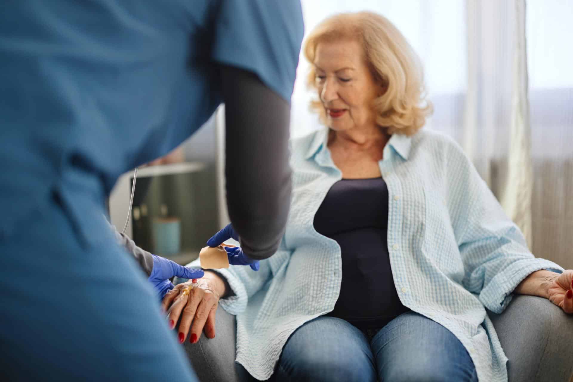 Senior receiving IV therapy