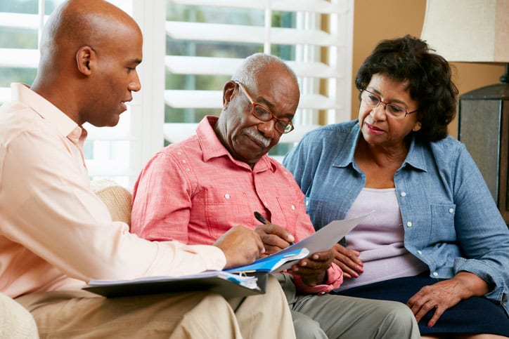 Staff member discussing services with a couple